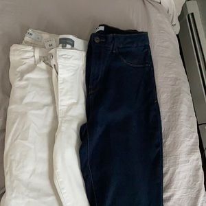 pairs of jeans size 10. One white , one denium